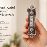 Hand holding a Pearlescent Kotel Heart brown pewter mezuzah with enamel finish, raised Shin and blue heart-shaped Star of David accents