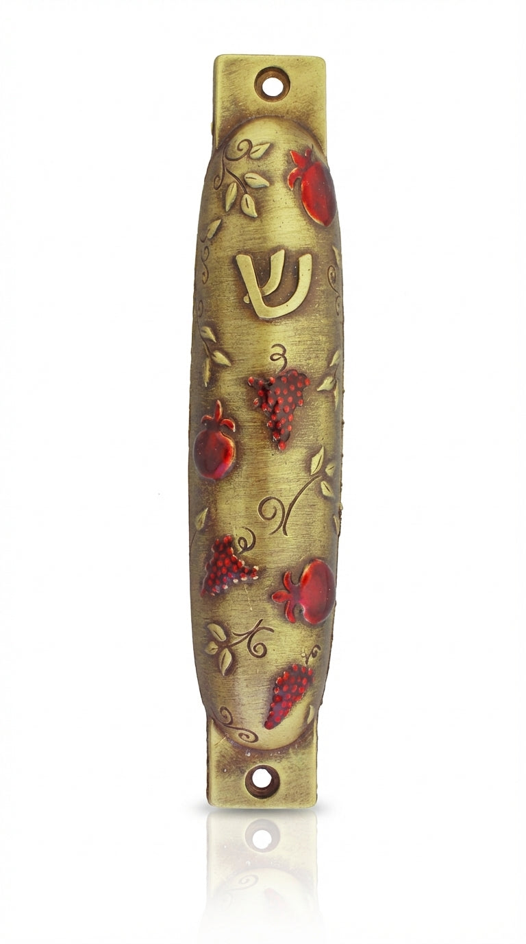Brass mezuzah decorated with ripe pomegranate design, crafted by Israeli artist Emanuel, suitable for home doorways for Jewish tradition.