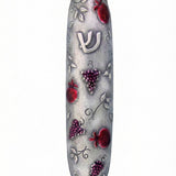 Pewter mezuzah featuring vibrant pomegranates design, crafted by Israeli artist Emanuel, with detailed Hebrew inscriptions and decorative motifs.