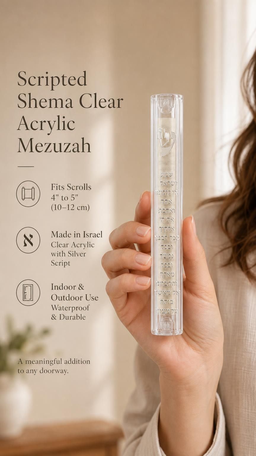 Person presenting the clear acrylic Shema mezuzah showing its transparency.