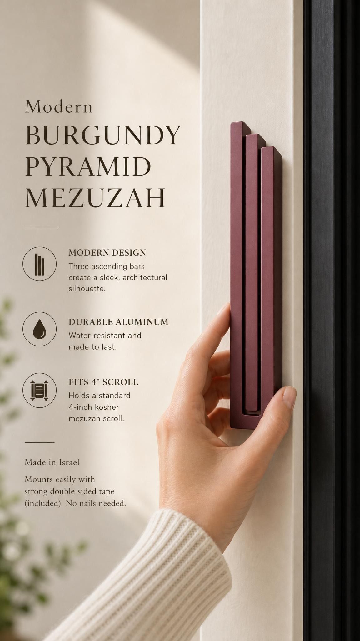 Person naturally holding the exact source mezuzah at realistic scale, with editorial text space, highlighting its shape, color, and material in a premium layout.
