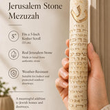 Person holding Ana B’Koach Jerusalem Stone Mezuzah, showing its design and size on a natural background.