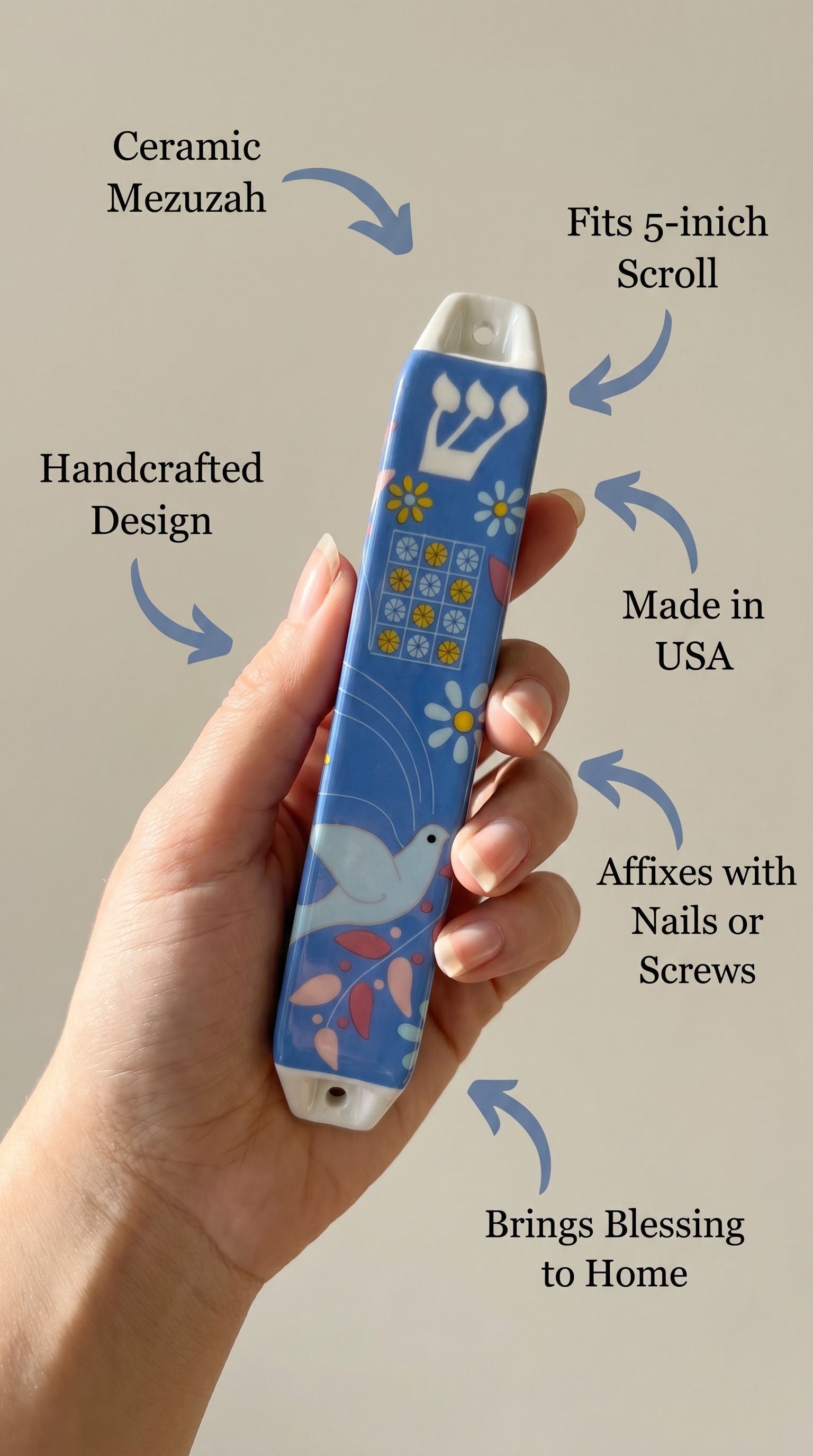 Person supporting a Dove of Peace ceramic mezuzah, showcasing material and size details in a clean setting.