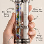 Minimalist callout image showing a person supporting an elegant mezuzah with product details and material focus.