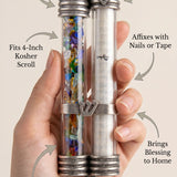 Minimalist callout image showing a person supporting an elegant mezuzah with product details and material focus.