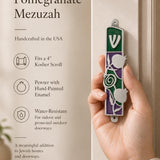 Person holding the precise mezuzah case at natural scale, showcasing its design, shape, and materials in a premium store setting.