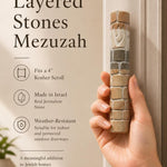 Person holding a genuine Jerusalem stone Mezuzah, showing its natural texture and dimensions in a lifestyle setting.