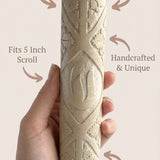 Person holding a Jerusalem Stone mezuzah, highlighting its natural material, craftsmanship, and traditional Jewish symbolism.