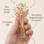 Minimalist callout image with a person holding the pastel tree of life mezuzah, highlighting its material, size, and design.