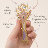 Minimalist callout image with a person holding the pastel tree of life mezuzah, highlighting its material, size, and design.