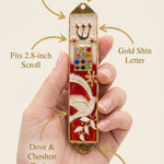 Minimalist callout image of a person holding the Twelve Jewels Dove Red Mezuzah, emphasizing the product's details and craftsmanship.