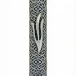 Elegant pewter filigree mezuzah with detailed design, showcased on a white studio background with soft reflection.