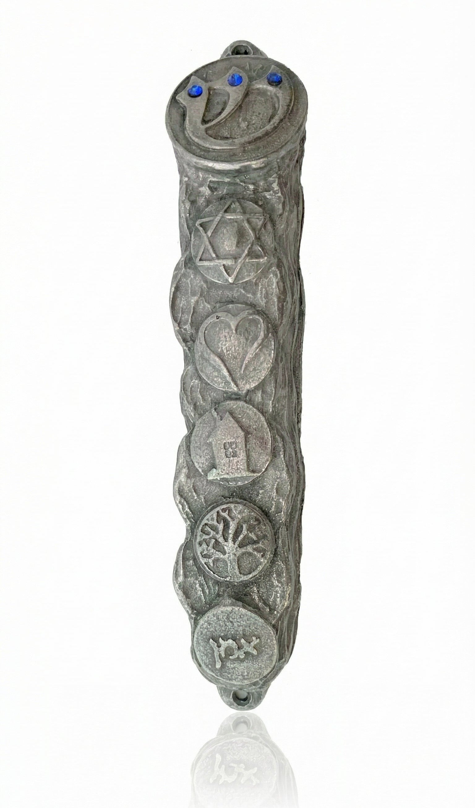 Detailed pewter mezuzah, 5 inches tall, with engraved Hebrew letters, decorative motifs, and a clear reflection on a white studio background.