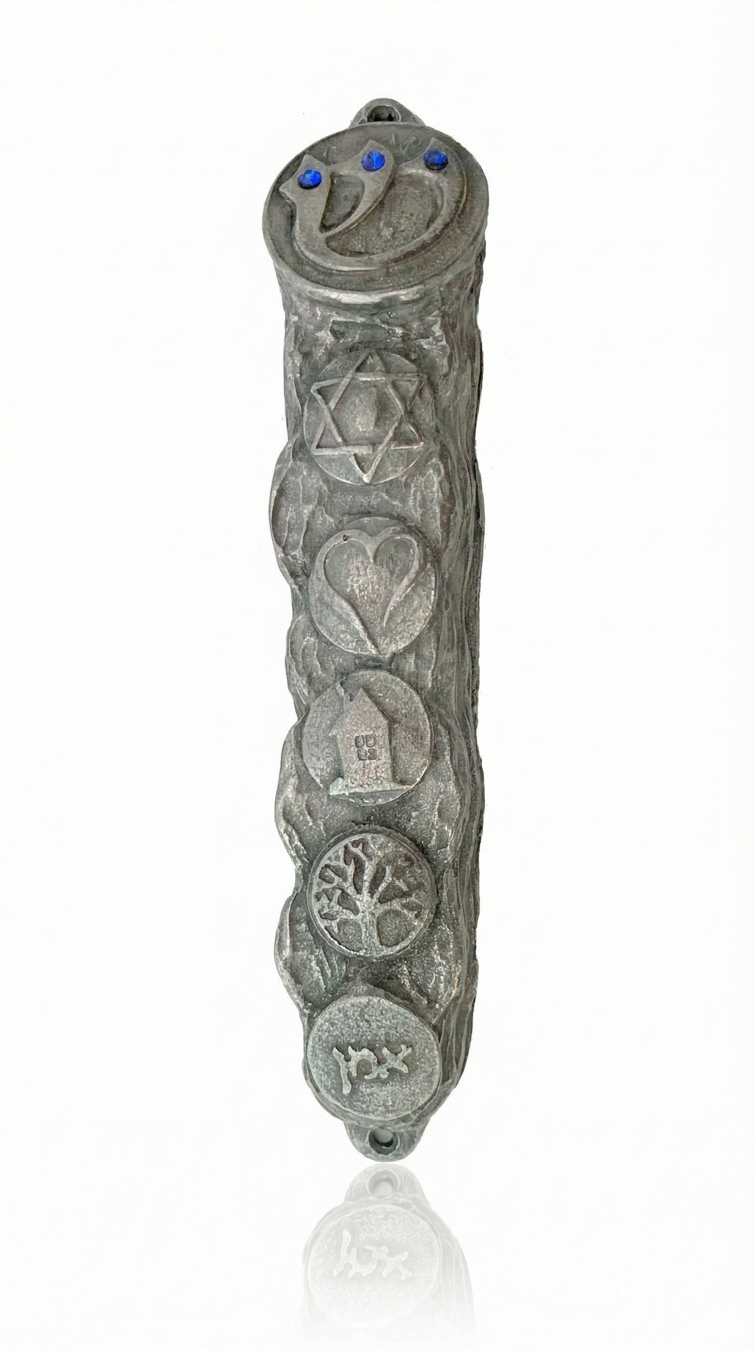 Detailed pewter mezuzah, 5 inches tall, with engraved Hebrew letters, decorative motifs, and a clear reflection on a white studio background.