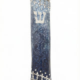 pewter Torah scroll mezuzah case with blue and white enamel, displayed on a white studio background with a soft reflection