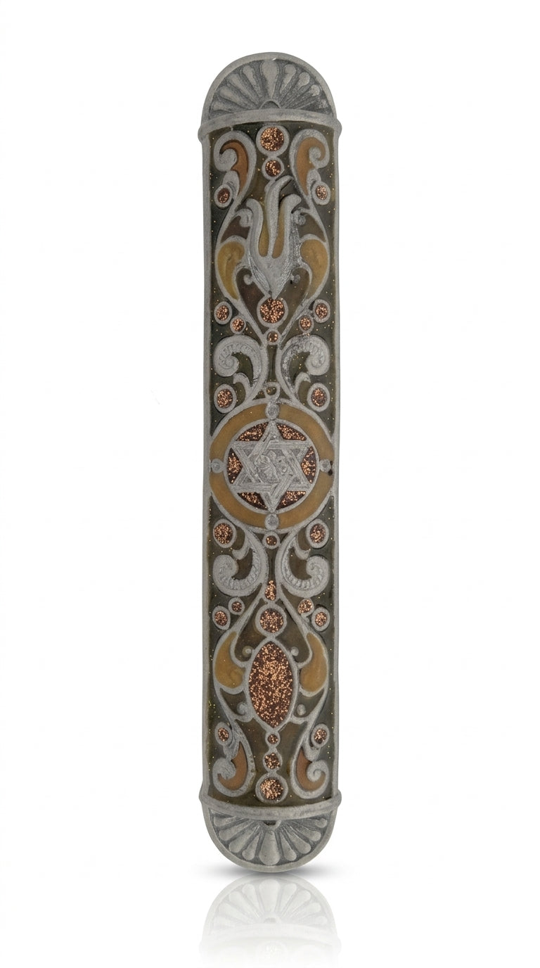 Detailed pewter mezuzah with Hebrew inscriptions, decorative motifs, and engraved design on a white studio background with light reflection.