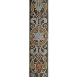 Detailed pewter mezuzah with Hebrew inscriptions, decorative motifs, and engraved design on a white studio background with light reflection.