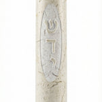 Close-up of a handcrafted Jerusalem stone Mezuzah with Hebrew 'Shadadai' inscription, showcasing natural texture and elegant design.