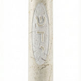 Close-up of a handcrafted Jerusalem stone Mezuzah with Hebrew 'Shadadai' inscription, showcasing natural texture and elegant design.