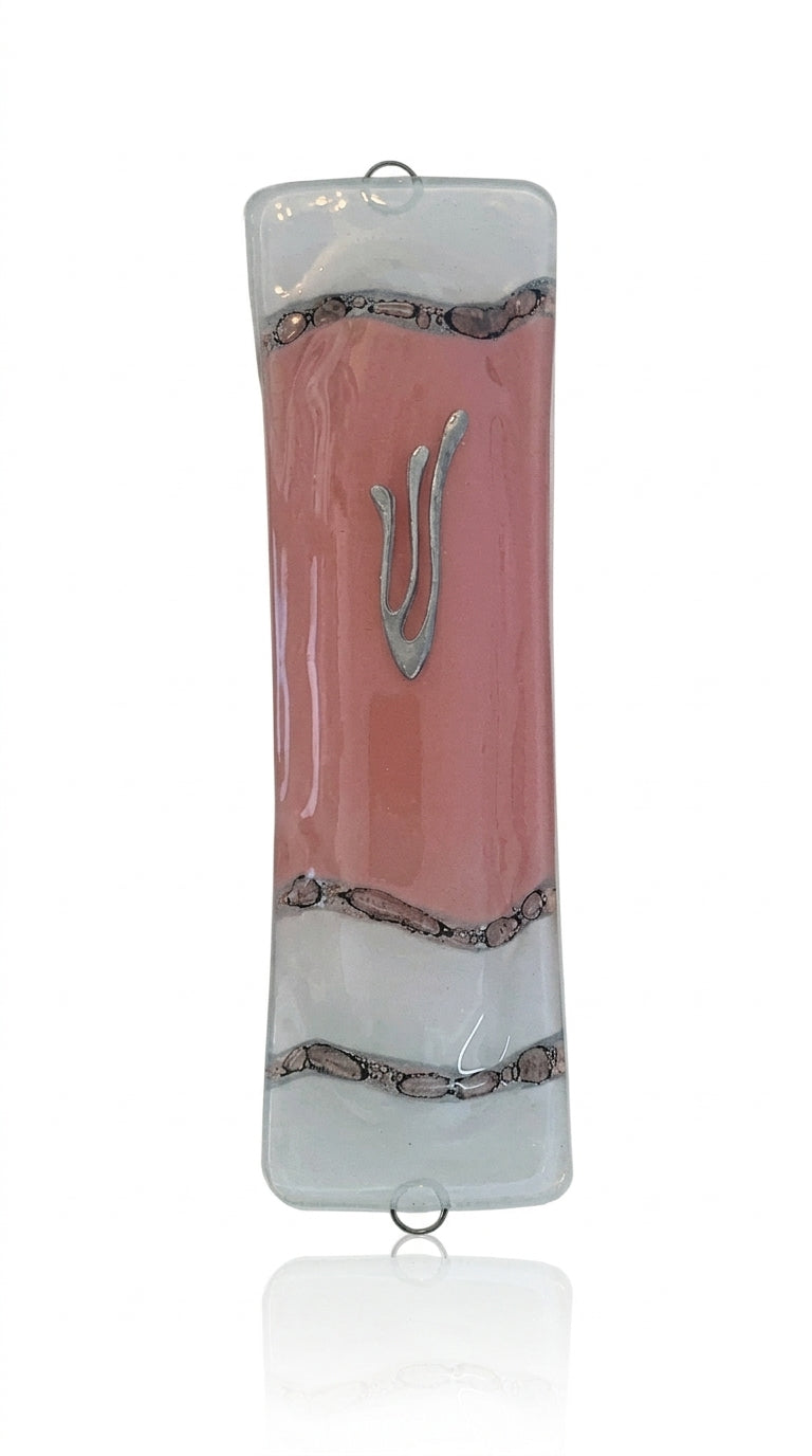 Pink glass Mezuzah measuring 4.5 inches tall, with detailed Hebrew engravings and decorative motifs, displayed on a white studio background with a soft reflection.