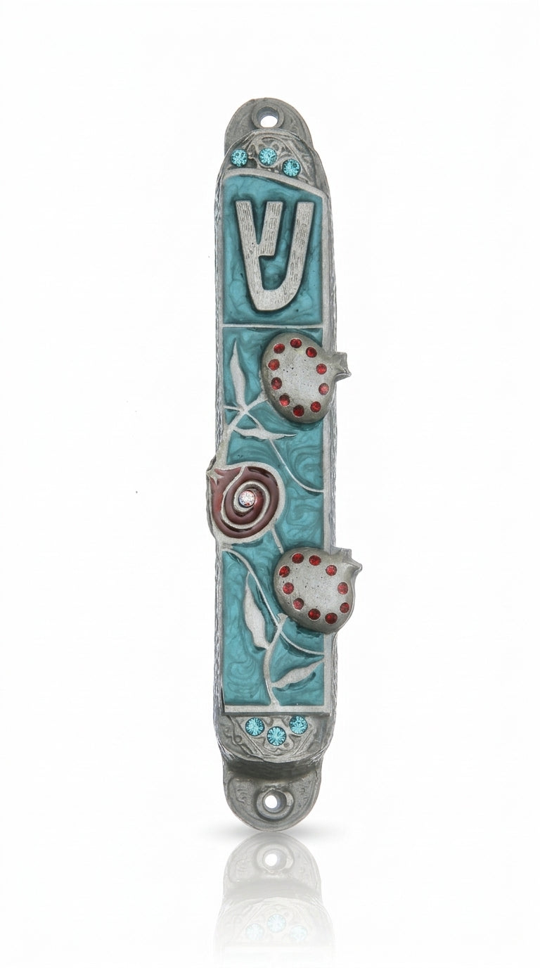 High-resolution image of a hand-painted pewter Mezuzah with pomegranate design on a pure white background, including a soft reflection.