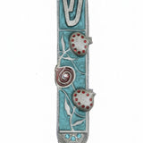 High-resolution image of a hand-painted pewter Mezuzah with pomegranate design on a pure white background, including a soft reflection.