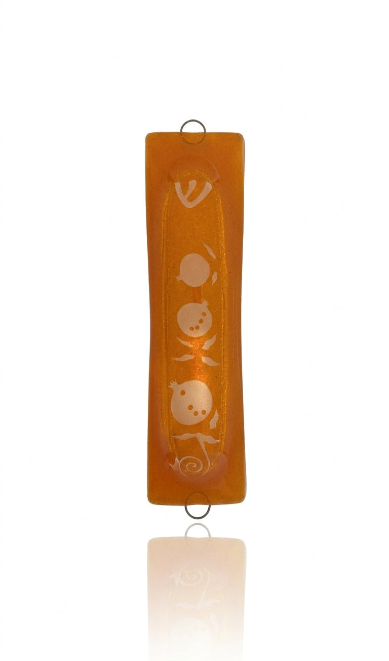 Elegant Pomegranate Glass Mezuzah made in Israel, detailed with Hebrew engravings and decorative motifs, placed on a clean white background with soft reflection.