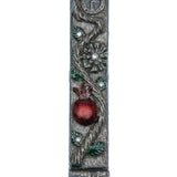 Detailed pomegranate mezuzah made of pewter with hand-painted enamel, featuring Hebrew inscriptions and decorative motifs, suitable for doorposts.