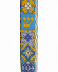 Upscale Portugal Mezuzah made of ceramic, detailed engravings and Hebrew text, displayed with clean white background and soft reflection.