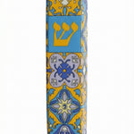 Upscale Portugal Mezuzah made of ceramic, detailed engravings and Hebrew text, displayed with clean white background and soft reflection.