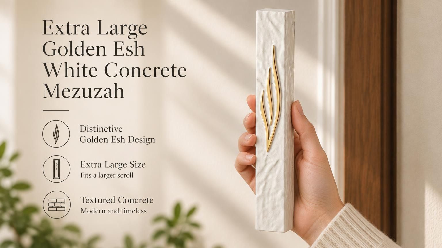 Hand holding an extra large golden Esh mezuzah made of textured white concrete for a doorway.