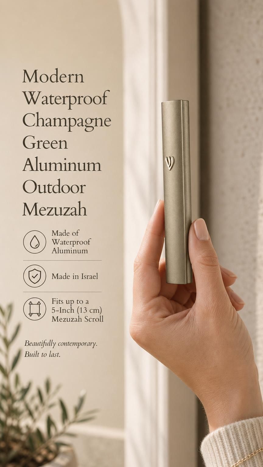 Close-up of a person holding the champagne green aluminum outdoor mezuzah, emphasizing its sleek and muted metallic finish.