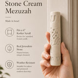 Person holding a Jerusalem stone mezuzah at realistic scale, emphasizing natural material and precise proportions for display.