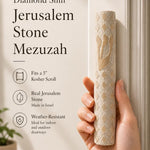 Person holding the exact Jerusalem Stone Mezuzah with cream color, carved diamond pattern, and gold Shin, in a natural, balanced composition.