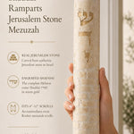 Close-up of the Jerusalem stone mezuzah with engraved Hebrew name Shaddai, textured surface, and gold accents in a refined editorial style.