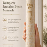 Close-up of the Jerusalem stone mezuzah with engraved Hebrew name Shaddai, textured surface, and gold accents in a refined editorial style.