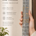 Close-up of the Jerusalem stone mezuzah with Hebrew blessing engraving, emphasizing its texture and design.