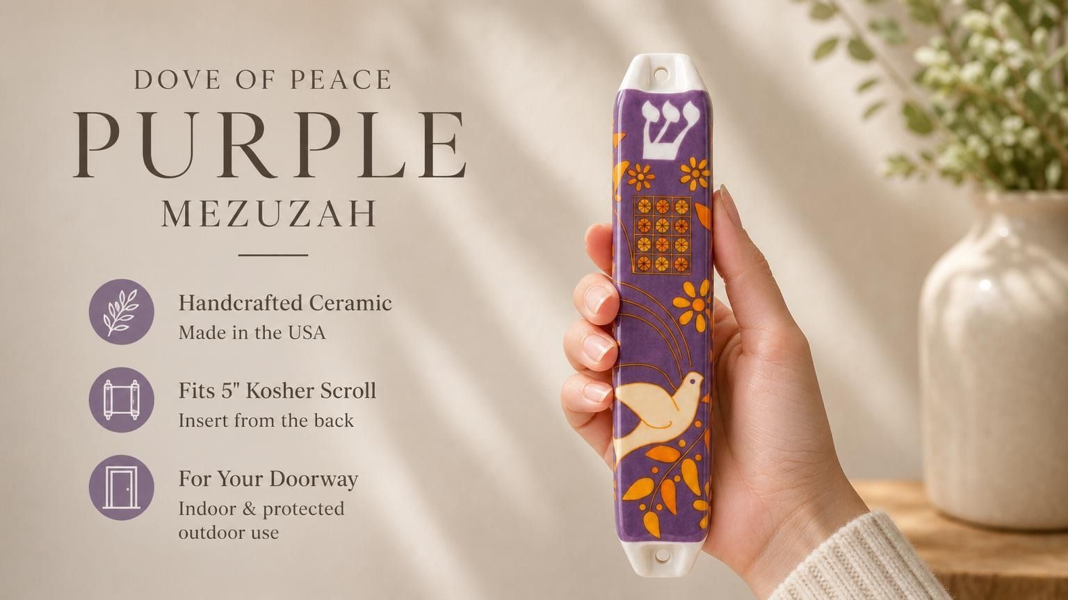 Hand-holding purple Dove of Peace mezuzah with white dove motif and orange accents, placed beside editorial text for premium presentation.