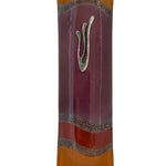 Elegant purple glass mezuzah measuring 4.5 inches with Hebrew inscriptions and decorative motifs, displayed on a white studio surface with light reflection.