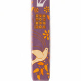 Decorative mezuzah case with floral and bird design on a white background