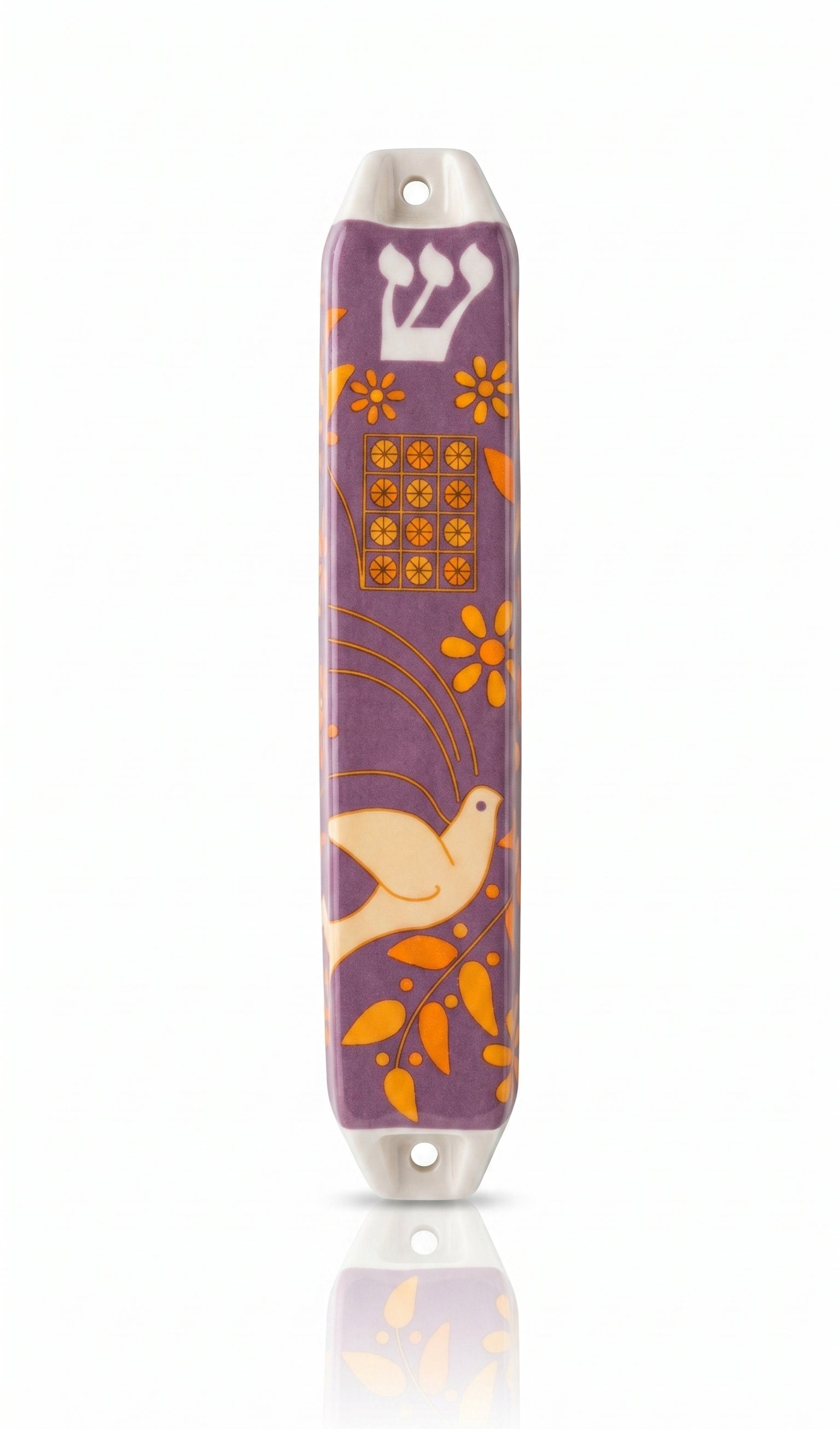Decorative mezuzah case with floral and bird design on a white background