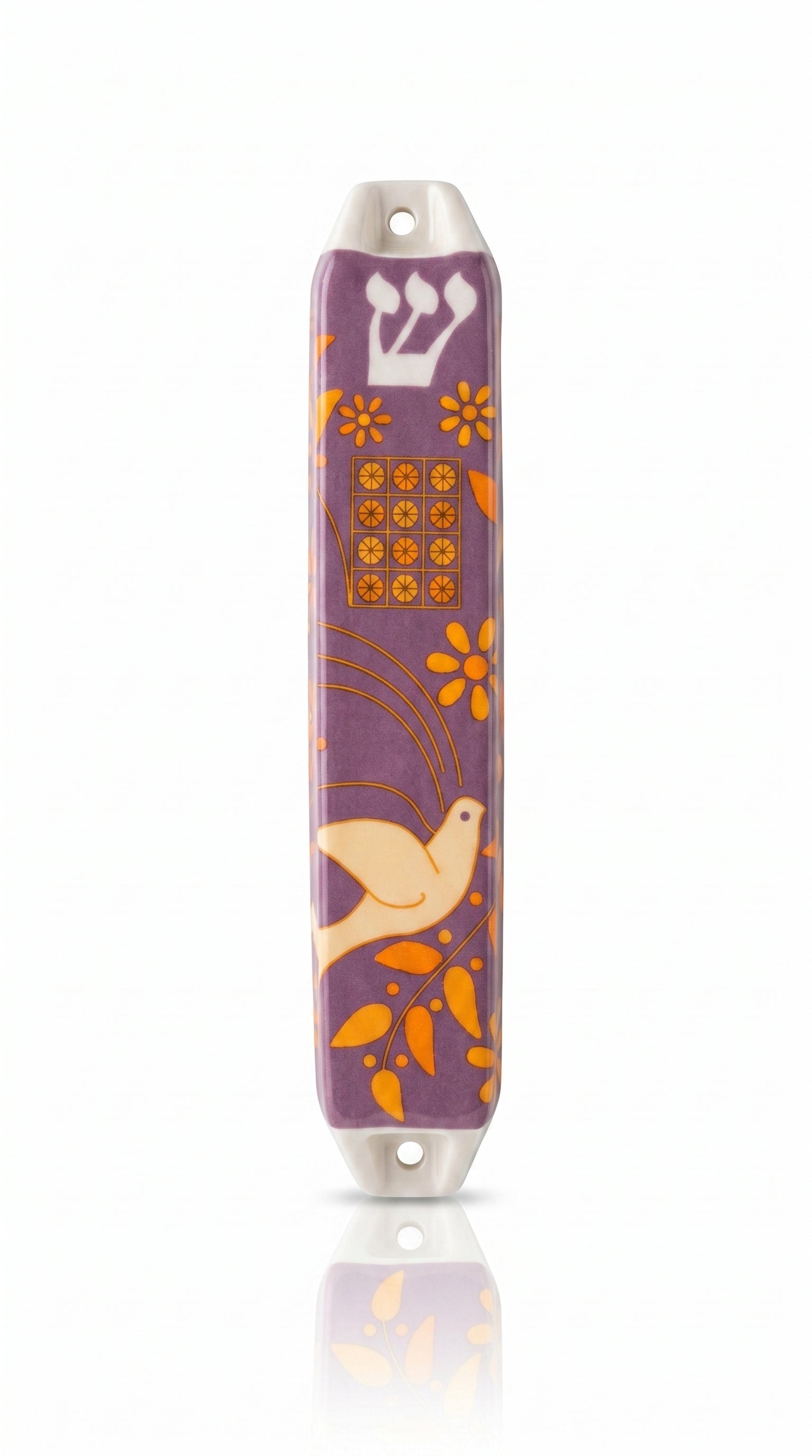 Decorative mezuzah case with floral and bird design on a white background
