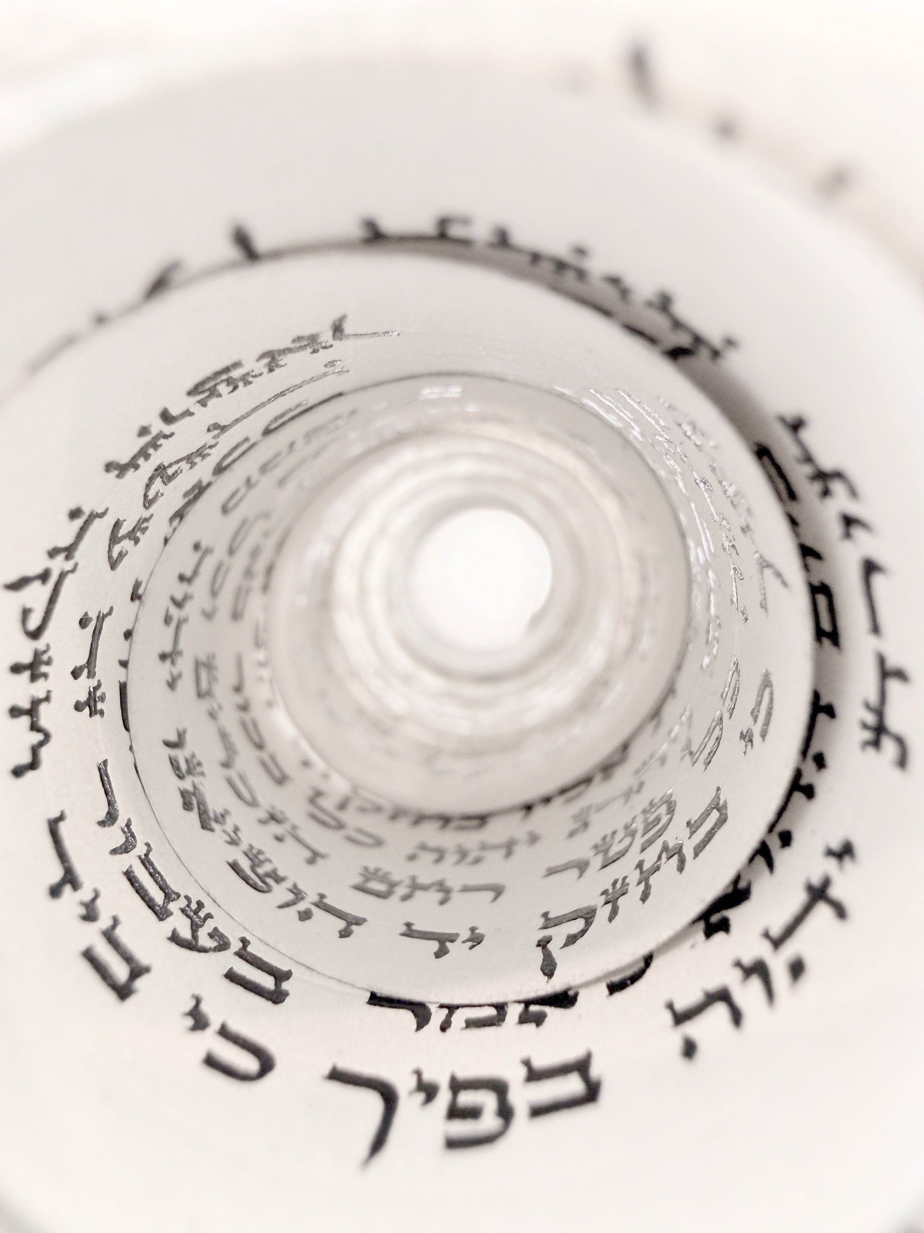 Handwritten parshiyos coiled inside the bayis, black STaM ink on klaf, ktav Alter Rebbe Rabbeinu Tam tefillin