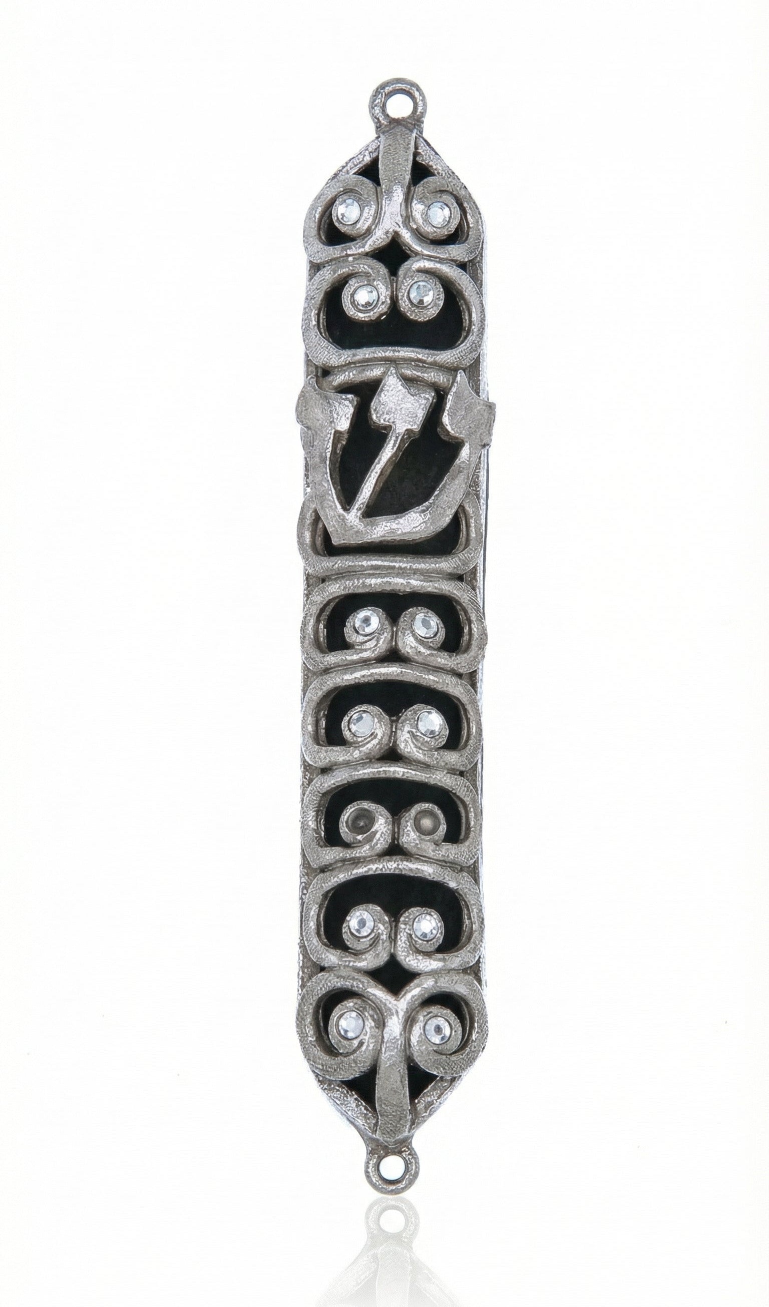 High-resolution image of a pewter Ram Mezuzah with curved ram horn shapes, accented with clear sequins, set against a bright white studio background with a subtle reflection.