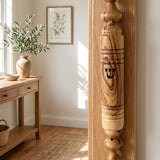 Lifestyle room scene with olive wood mezuzah mounted on door, highlighting natural material and home decor.