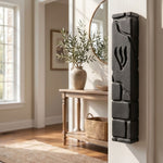 Lifestyle image of a home interior featuring a black cement mezuzah mounted on the doorpost in a well-lit, inviting room setting.