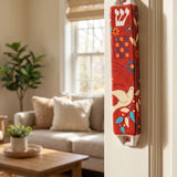 Hyper-realistic scene of a red dove of peace ceramic mezuzah on inside doorway frame, highlighting its vibrant colors and detailed design in a warm home interior.