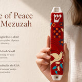 Hand-held red Dove of Peace mezuzah with blue and white accents, showcasing its vibrant ceramic finish and Judaica motifs for doorway decoration.