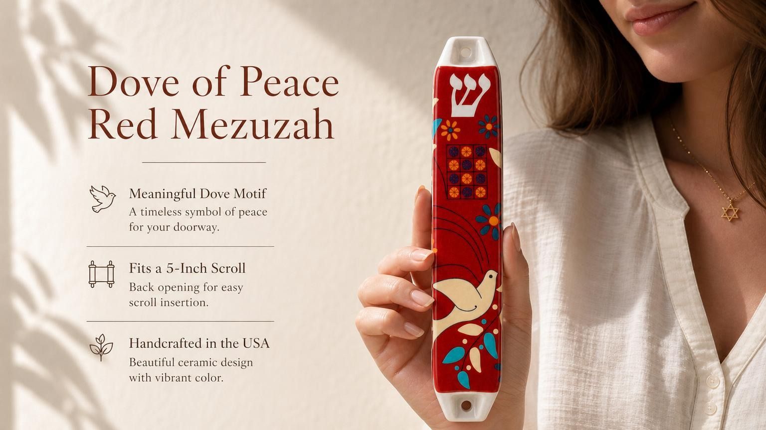 Hand-held red Dove of Peace mezuzah with blue and white accents, showcasing its vibrant ceramic finish and Judaica motifs for doorway decoration.