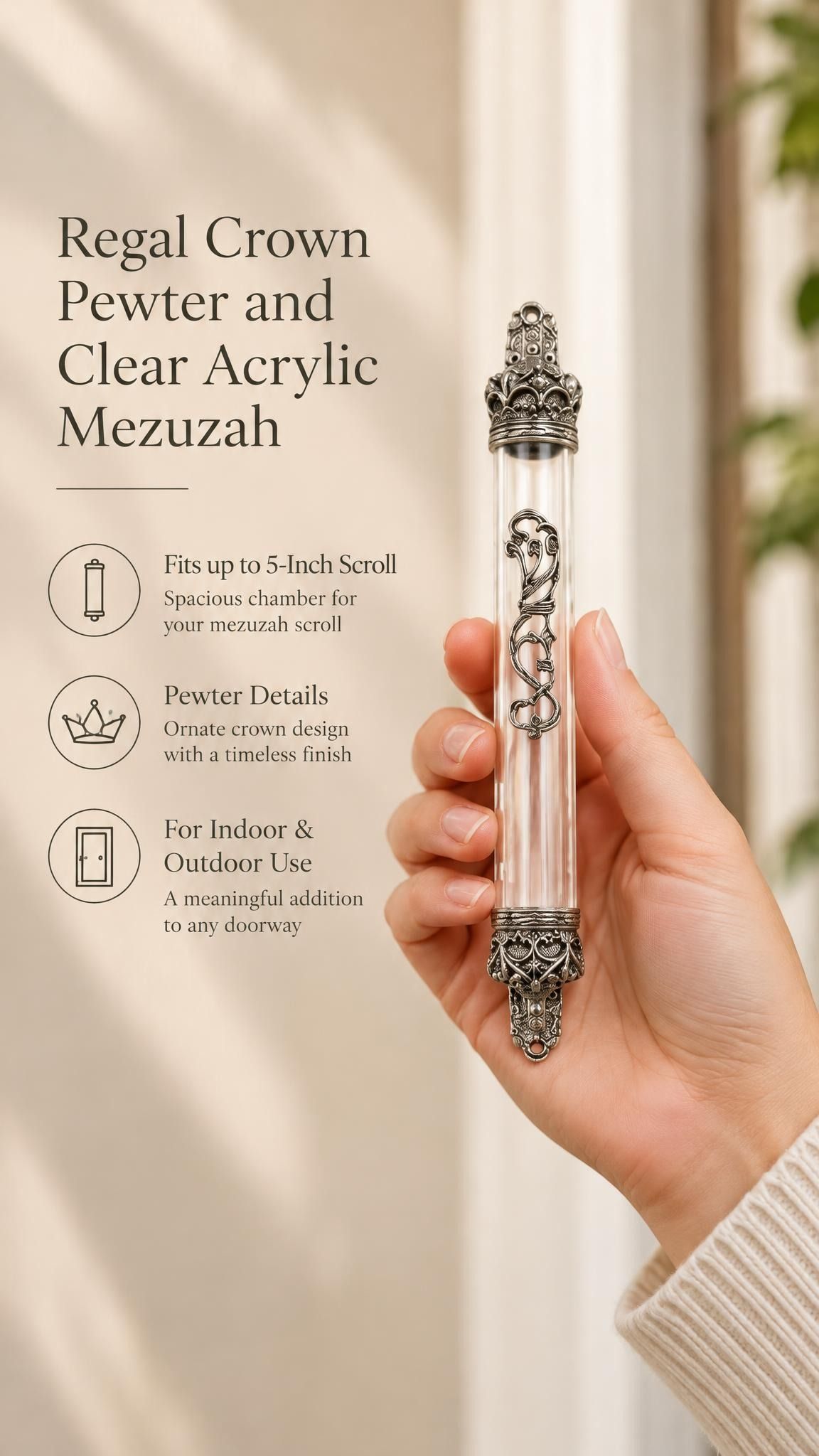 Handheld portrait of the Regal Crown Pewter and Clear Acrylic Mezuzah mezuzah cover, with a transparent acrylic chamber framed by silver-toned pewter crown ends, dark recessed details and curling front scrollwork clearly visible beside the product name and illustrated features of this distinctive Jewish doorway design